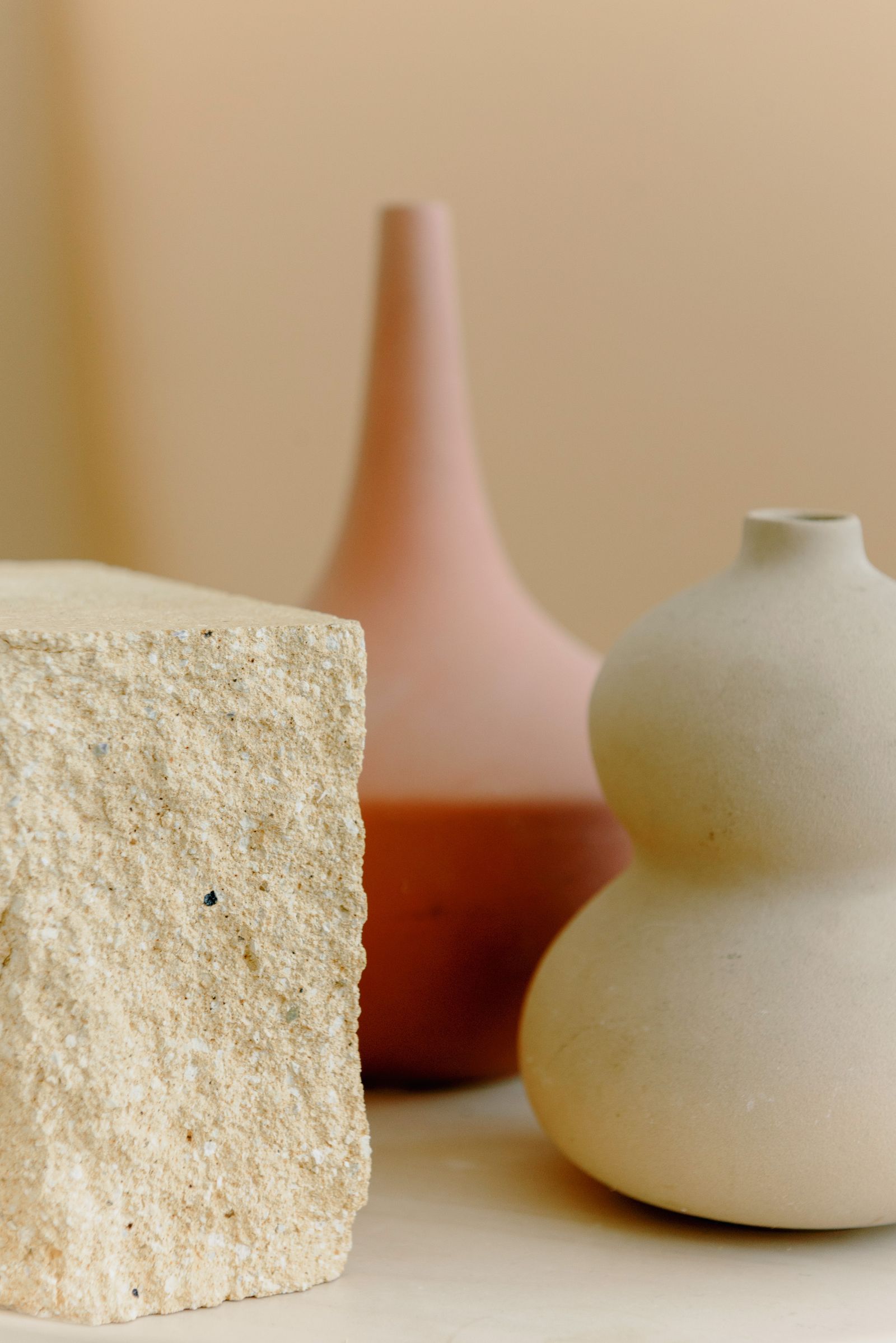 Stone and clay vessels in warm light